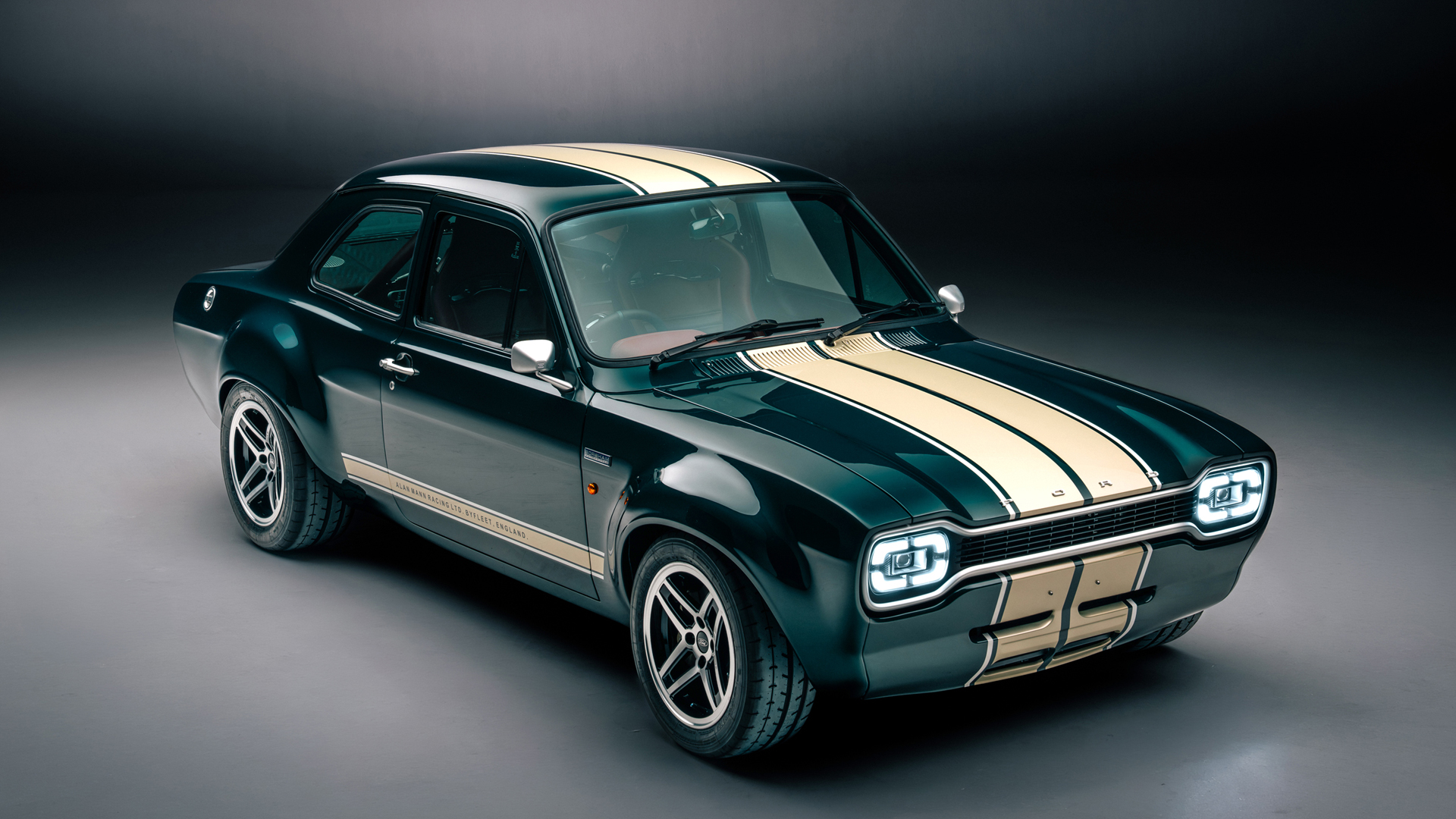Boreham Motorworks Ford Escort Mk1 RS in dark green with cream racing stripes.